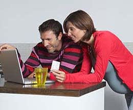 two people looking at computer